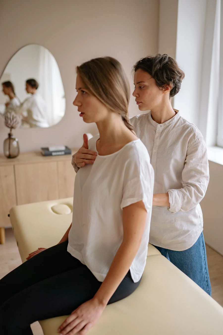 Therapist giving hands-on shoulder treatment