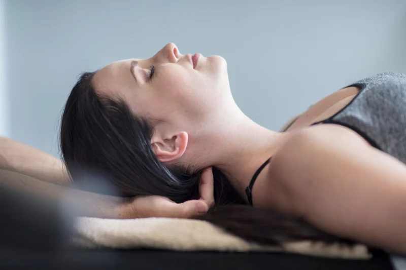 Man practicing slow breathing, seated and calm